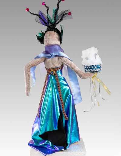 Crone - Wise Woman, back, 16” W x 28” H x 12” D, fabric, hair, basket, found objects on wire armature, wood base, $1,050